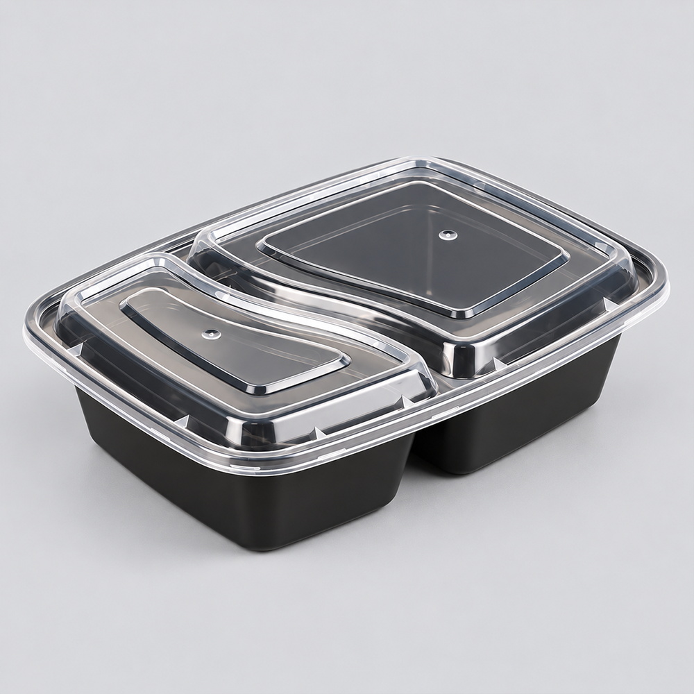Black two-compartment rectangular food container with clear lid