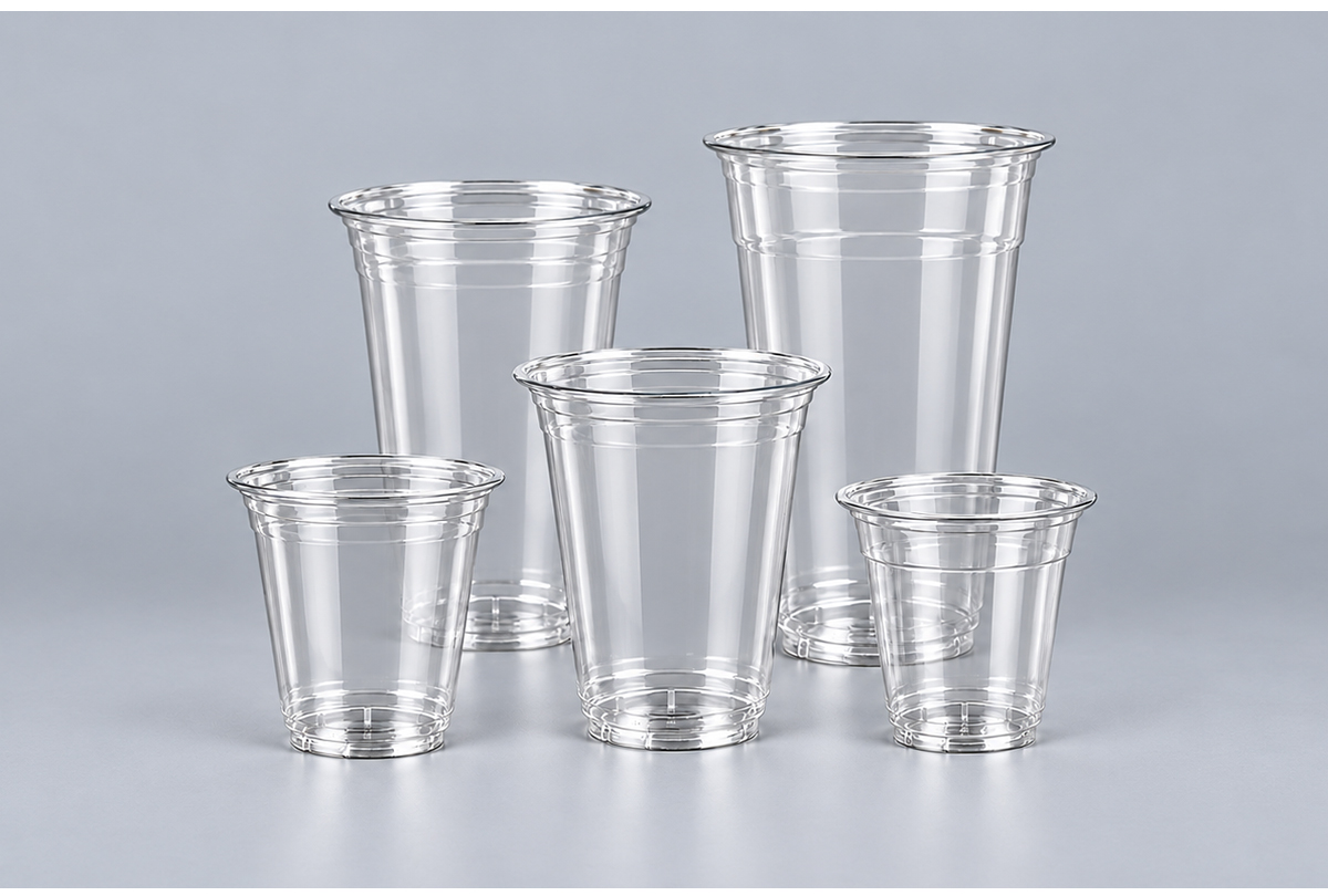 Five clear PET cups of different heights on grey background