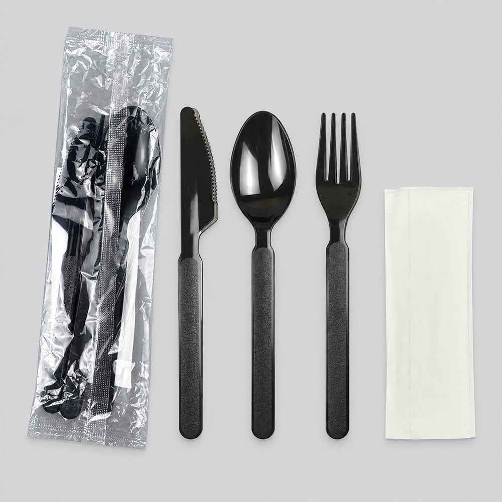 Black disposable knife, spoon and fork kit with napkin and wrapper