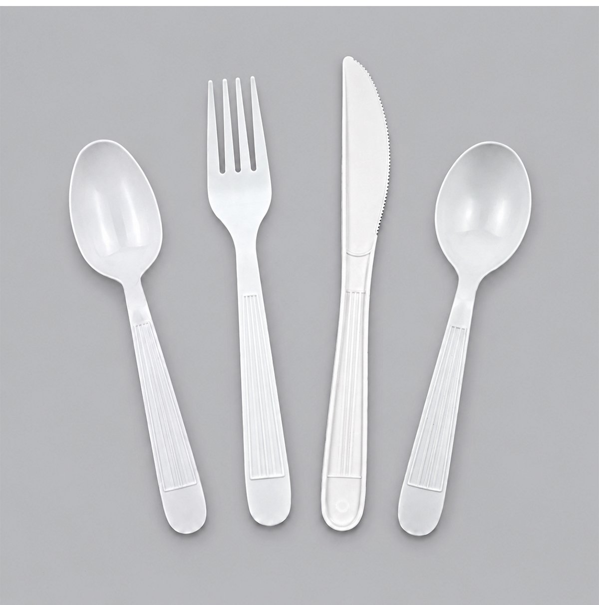 White ribbed-handle spoon, fork, knife and soup spoon