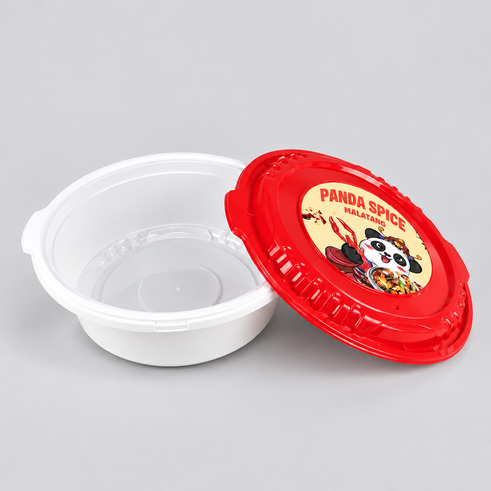 Open white bowl beside red lid with panda label