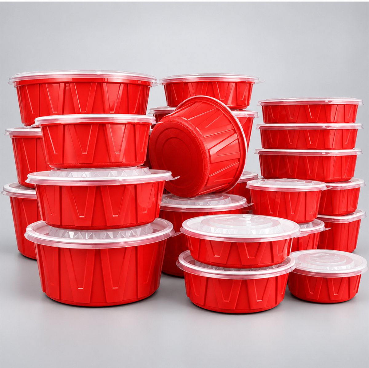 Assorted red round food bowls with clear lids stacked together
